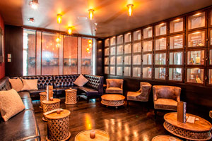 The Tequila Room - Private space | 20 people cocktail reception <br> Complete with tufted leather sofas, high back lounge chairs, & surrounded with tequila lockers, guests will enjoy drinks & dining in an intimate setting with a hint of mystery.